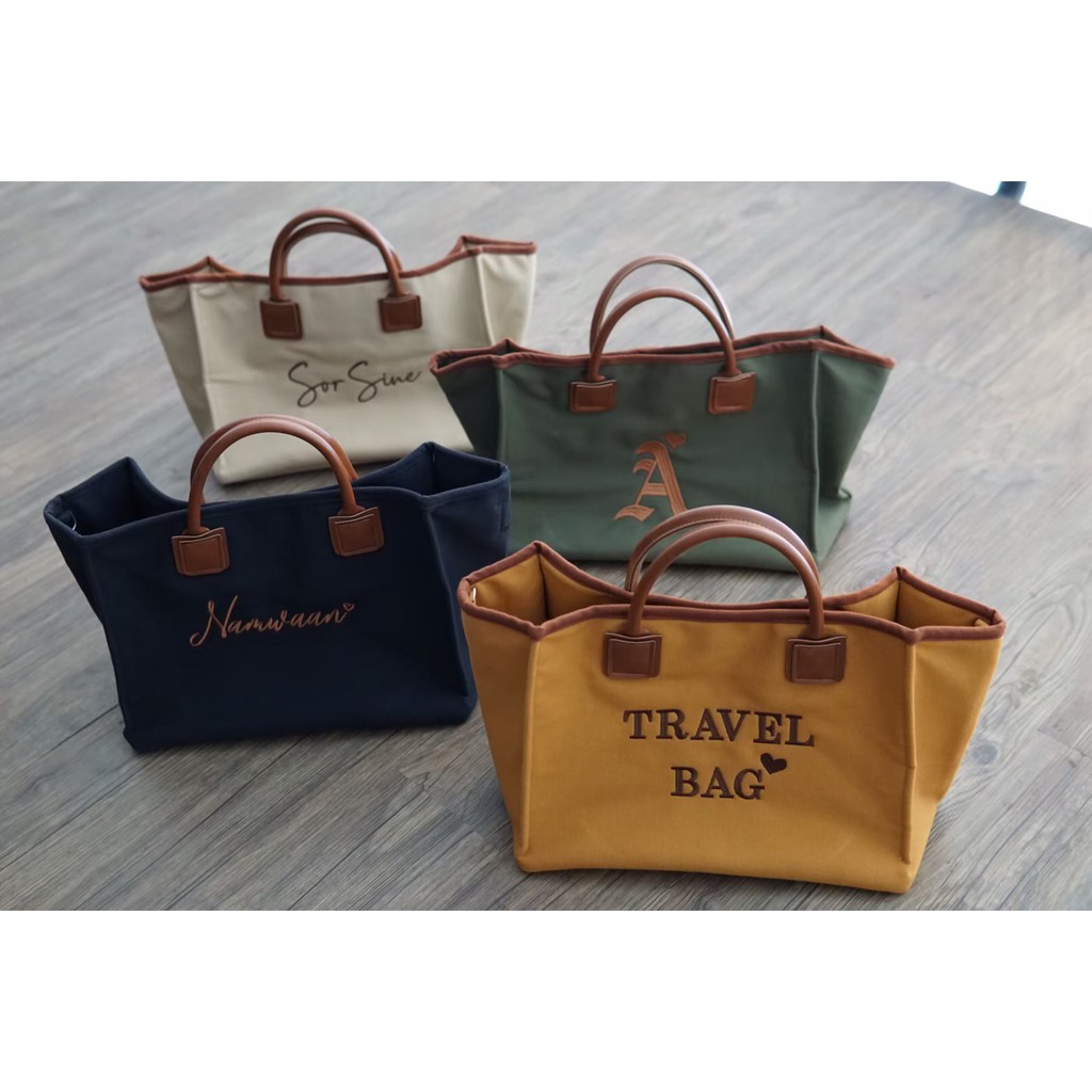 รุ่น-travel-bag-กระเป๋าผ้าแคนวาสพร้อมปักชื่อใบใหญ่-กระเป๋าเดินทาง-กระเป๋าสะพาย-ปักชื่อได้ตามต้องการ