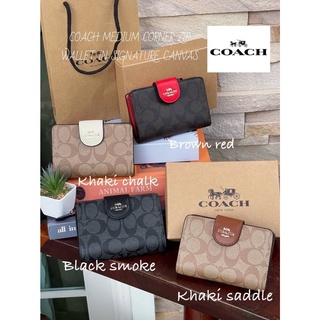 กระเป๋าสตางค์ขนาดกลาง​ COACH MEDIUM CORNER ZIP WALLET IN SIGNATURE CANVAS