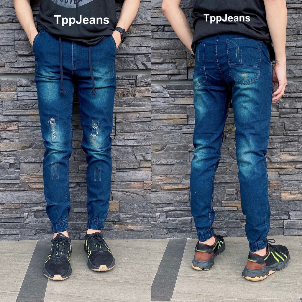 ภาพหน้าปกสินค้าJEANSEXPRESS Jogger Jeans กางเกงยีนส์จ้อกเกอร์ขาจั้ม สีบลูฟอกสนิมแต่งขาด เป้าซิปเอวยางมีเชือก ทรงสลิม Size 28-36