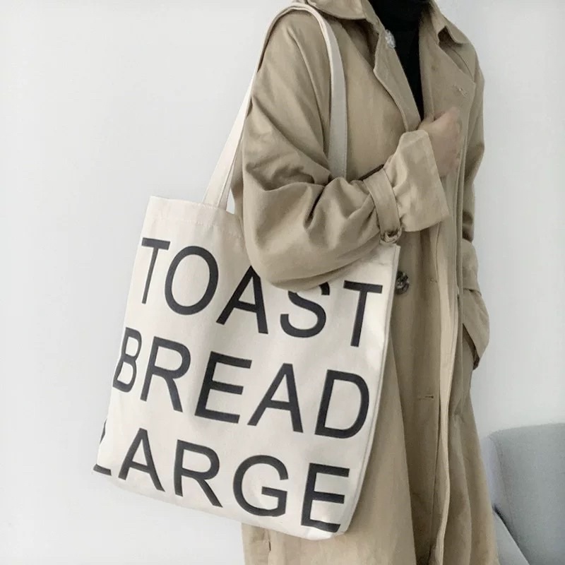 ภาพหน้าปกสินค้ากระเป๋าผ้าสกรีน Toast bread large จากร้าน kamell_bear บน Shopee