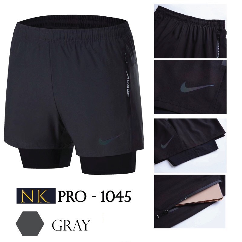 ภาพหน้าปกสินค้า2in1 กางเกงขาสั้นกีฬาสำหรับผู้ชาย กางเกงซํบเลคกิ้ง กางเกงมีกระเป๋าซิป ทั้งสองด้าน( Slime fit ) รุ่น NK - 1045 จากร้าน amyklds บน Shopee