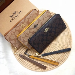 COACH LONG ZIP AROUND WALLET IN SIGNATURE CANVAS ส่งฟรี