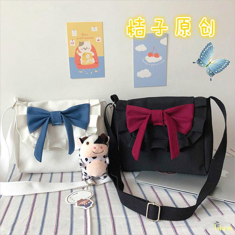 hot-sale-lolita-retro-sweet-bow-soft-girl-canvas-bag-korean-ins-girl-heart-messenger-bag-jk-bag-กระเป๋า