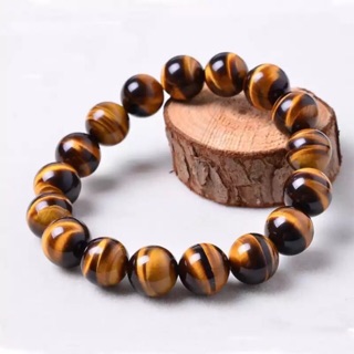 ภาพขนาดย่อของสินค้าไทเกอร์อาย (Tigers Eye) ขนาด 10 mm. **หินมงคล หินแห่งความมั่งคั่ง ร่ำรวย** หินแท้ 100%