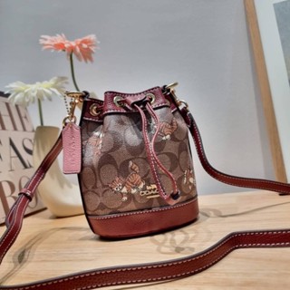 COACH CC431 MINI DEMPSEY BUCKET BAG IN SIGNATURE CANVAS WITH DANCING KITTEN PRINT