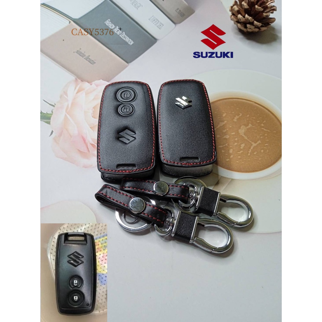 ปลอกกุญแจรถซูซูกิ-suzuki-swift-grand-vitara-ซองกุญแจหนังแท้หุ้มรีโมทรถเคสหนังแท้ใส่กุญแจรถยนต์กันรอยกันกระแทกสีดำด้ายแดง