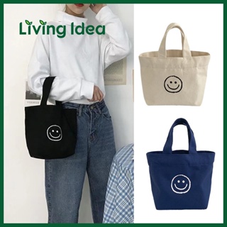 ภาพขนาดย่อของภาพหน้าปกสินค้าLiving Idea  กระเป๋าถือ สไตล์เกาหลี แฟชั่นน่ารัก smiley พร้อมส่ง กระเป๋าผ้าแคนวาส ขนาดมินิ จากร้าน living.idea บน Shopee