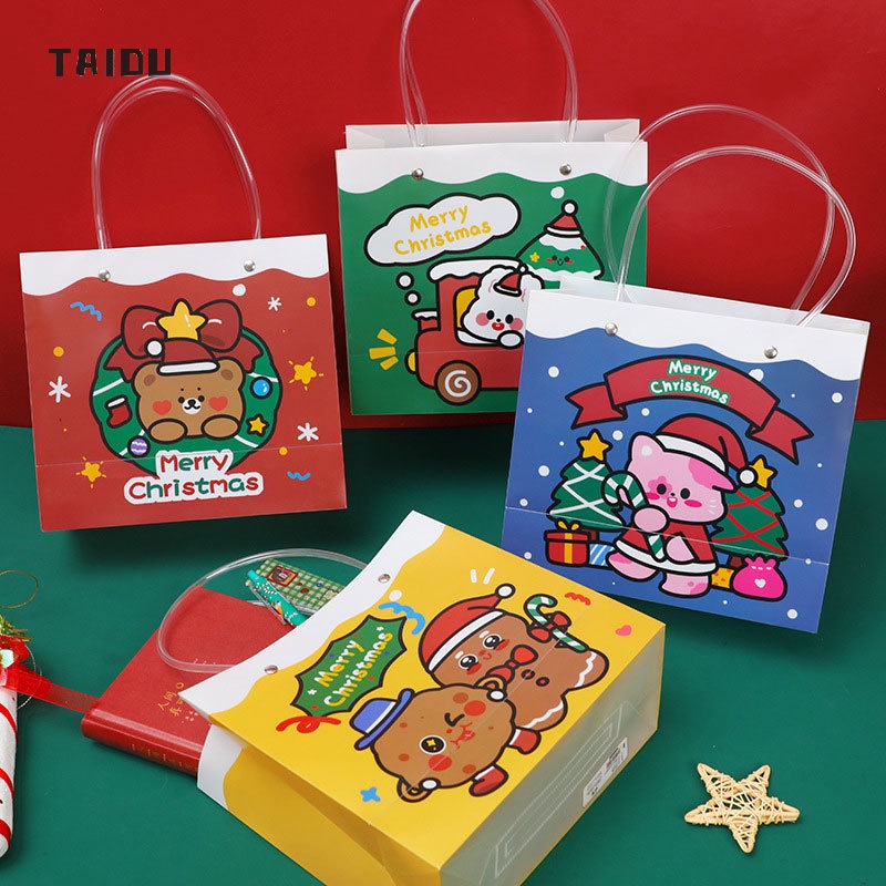 ภาพหน้าปกสินค้าTAIDU ถุงคริสต์มาส ถุงของขวัญคริสต์มาส Ins น่ารัก ของขวัญคริสต์มาส ถุงบรรจุภัณฑ์ ดูดี PVC กระเป๋าพกพา กระเป๋าถือ