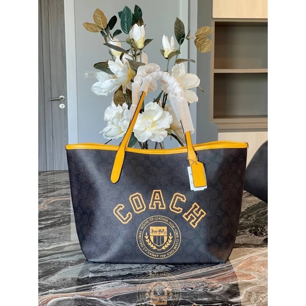 coach-city-tote-in-signature-canvas-with-varsity-motif