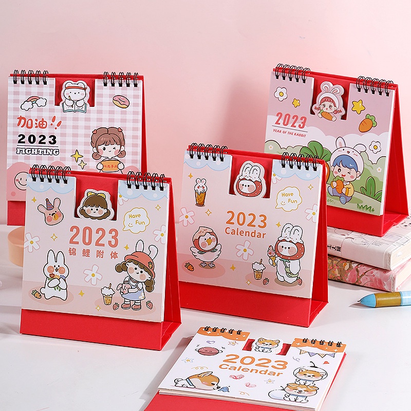 ภาพหน้าปกสินค้าปฏิทิน2023 "ปฏิทินตั้งโต๊ะ2023 ลายการ์ตูนสีPastel" ปฎิทินตั้งโต๊ะน่ารักปี 2023 ปฏิทิน2566