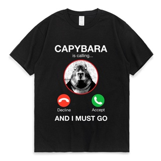 เสื้อยืดแขนสั้น ผ้าฝ้าย 100% พิมพ์ลายกราฟิก Capybara Is Calling and I Must Go โอเวอร์ไซซ์ สําหรับผู้ชาย ผู้หญิง