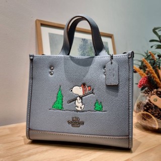 COACH x PEANUTS DEMPSEY TOTE 22 IN SIGNATURE CANVAS WITH SNOOPY SKI MOTIF