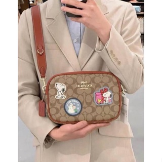 Coach CF304 X Peanuts Jamie Camera Bag In Signature Canvas With Patches