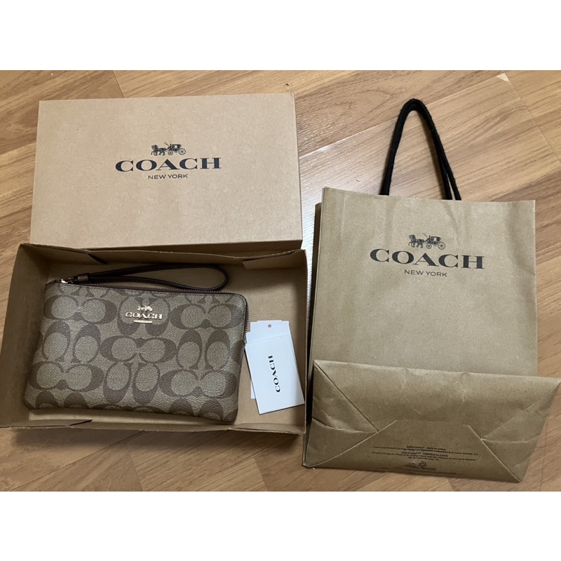 ส่งต่อ COACH LARGE WRISTLET IN SIGNATURE CANVAS IM KHAKI SADDLE 2 แท้