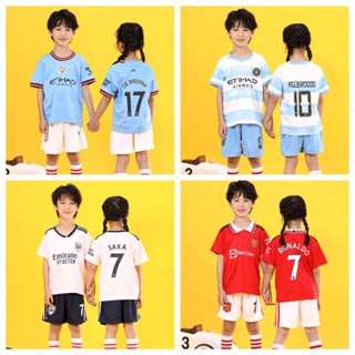 เสื้อกีฬาแขนสั้น ลายทีมฟุตบอล Manchester City Manchester United ระบายอากาศ แห้งเร็ว สําหรับเด็ก 23 ชิ้น