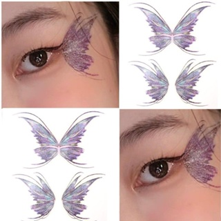 Small red book with sparkling butterfly wings tattoos affixed to the corners of the eyes, waterproof childrens eye makeup portraits