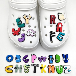 ภาพหน้าปกสินค้าJibbitz รองเท้าแตะ Crocs ลายการ์ตูนตัวอักษรน่ารัก ของขวัญสําหรับเด็ก ตัวอักษรภาษาอังกฤษ shoe charms ถอดออกได้ ของขวัญสําหรับเด็ก ที่เกี่ยวข้อง