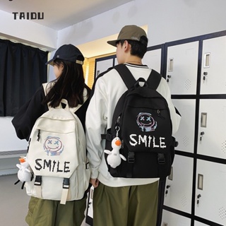 TAIDU [ไม่มีจี้]กระเป๋าเป้สไตล์เกาหลีมาใหม่ กระเป๋านักเรียนนักเรียนความจุขนาดใหญ่ กระเป๋าเป้สะพายหลังหน้ายิ้ม ไม่จำกัดเพศ แมตช์แบบสบาย ๆ