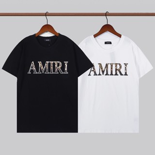 Amiri เสื้อยืดคอกลม แขนสั้น ผ้าฝ้าย พิมพ์ลายเสือดาว ตัวอักษร โมโนแกรม ทรงหลวม แฟชั่นฤดูร้อน สําหรับผู้ชาย และผู้หญิง