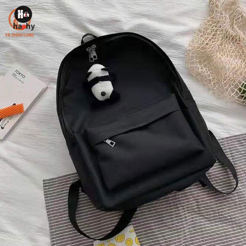 กระเป๋านักเรียนผู้หญิง-casual-street-photography-กระเป๋าสะพายหลังสีดำสไตล์ฮาราจูกุ