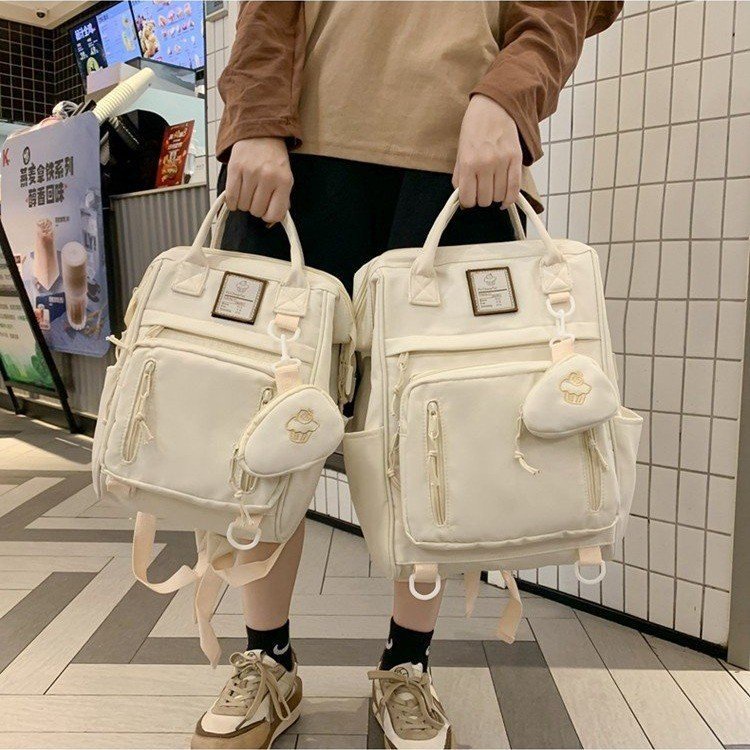 กระเป๋านักเรียนกระเป๋าเป้สะพายหลังเรียบง่ายรุ่นใหม่ฤดูร้อนกระเป๋าเป้สะพายหลังสำหรับนักศึกษาหญิง