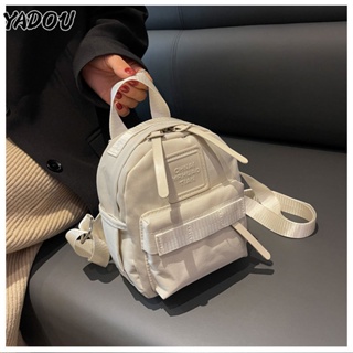 YADOU กระเป๋าเป้แฟชั่นใหม่กระเป๋าเป้สะพายหลังลำลองสีทึบวัสดุ PU กระเป๋าสะพายไหล่นักเรียนพร็อพขนาดเล็กและประณีต