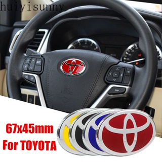 Hys สติกเกอร์ตราสัญลักษณ์ 67x45 มม. สําหรับตกแต่งพวงมาลัยรถยนต์ Toyota Camry Corolla Yaris Vios Hilux Avanza Tundra Rav4 Avensis Auris Fortuner 1 ชิ้น