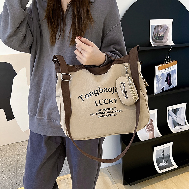 กระเป๋าสะพายผ้าใบความจุขนาดใหญ่เวอร์ชั่นเกาหลีใหม่กระเป๋าสะพายข้างแบบสบาย-ๆ-ของญี่ปุ่น