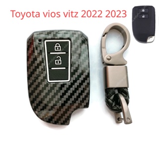 เคสกุญแจรีโมทรถยนต์ แบบแข็ง คาร์บอนไฟเบอร์ ซิลิโคน พร้อมพวงกุญแจ สําหรับ Toyota vios vitz 2022 2023 All-New Yaris 2018-2023