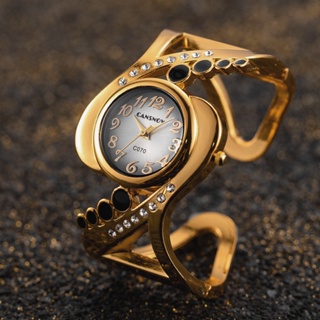 นาฬิกาข้อมือควอตซ์แฟชั่น สายแสตนเลส หน้าปัดกลม ประดับพลอยเทียม หรูหรา สไตล์โรแมนติก เรโทร สําหรับสตรี