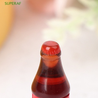 Superaf ขายดี โค้ก เครื่องดื่ม โซดา ขนาดเล็ก อุปกรณ์เสริม สําหรับตกแต่งบ้านตุ๊กตา ห้องครัว 4 ชิ้น