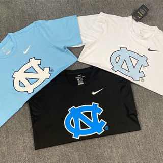 เสื้อยืดแขนสั้น ทรงหลวม ระบายอากาศได้ดี แบบแห้งเร็ว ลาย NCAA เหมาะกับเล่นกีฬาบาสเก็ตบอล สําหรับผู้ชาย