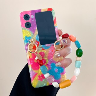 เคสโทรศัพท์มือถือแบบนิ่ม กันกระแทก ลายดอกไม้กราฟฟิตี้ หน้ายิ้ม พร้อมสายคล้องข้อมือ สําหรับ Oppo Find N2 Flip 5G