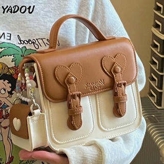 YAODU บล็อคสีครีม น่ารัก กระเป๋าเคมบริดจ์แฟชั่นญี่ปุ่นและเกาหลีสด ดีไซน์ Niche กระเป๋าสะพายข้างทรงสี่เหลี่ยมใบเล็ก