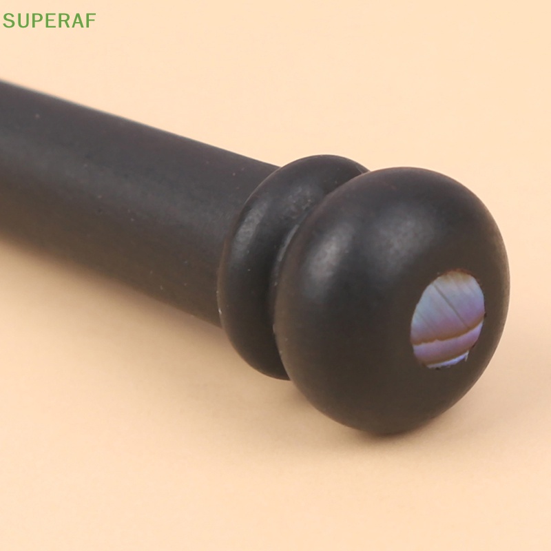 superaf-ขายดี-หมุดยึดสายกีตาร์โฟล์ค-ไม้มะเกลือ-สีพื้น-6-ชิ้น