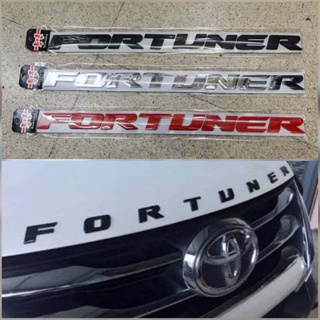 ป้าย fortuner ฝากระโปรงหน้าทุกรุ่น มี 3 สี สีดำ สีชุบโครเมี่ยม สีแดง**จำนวน1ชุด*ราคาถูกสินค้าดีมีคุณภาพ**