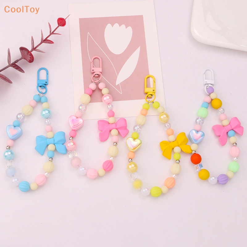 cooltoy-พวงกุญแจ-จี้ลูกปัด-รูปหัวใจ-ประดับโบว์-หลากสี-สําหรับตกแต่งกระเป๋า-หูฟัง