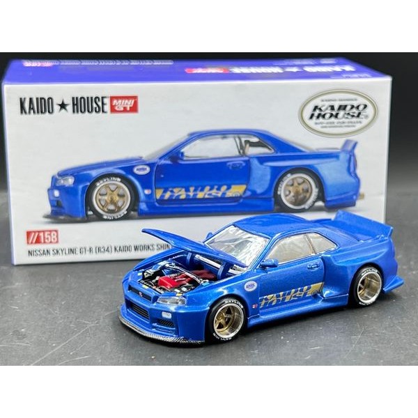KAIDO HOUSE X MINI GT – Nissan Skyline GT-R (R34) KAIDO SHINJUKU V2 – Modello Diecast Scala 1/64 – Blu Limited Edition #KHMG158