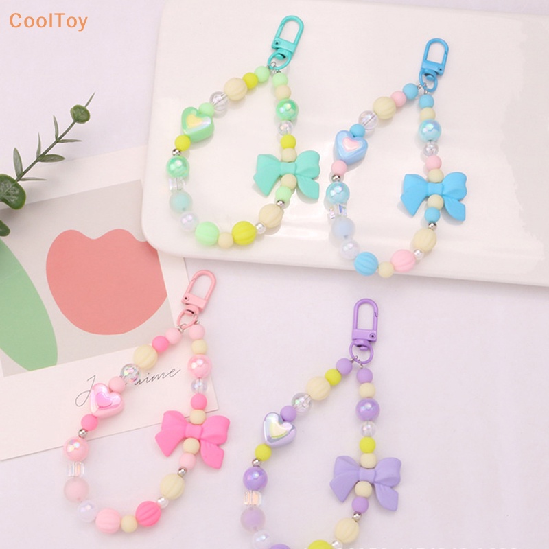 cooltoy-พวงกุญแจ-จี้ลูกปัด-รูปหัวใจ-ประดับโบว์-หลากสี-สําหรับตกแต่งกระเป๋า-หูฟัง