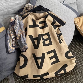 กระเป๋าผ้าแคนวาส พิมพ์ลายตัวอักษร จุของได้เยอะ แบบพกพา สไตล์บูติก สําหรับผู้หญิง