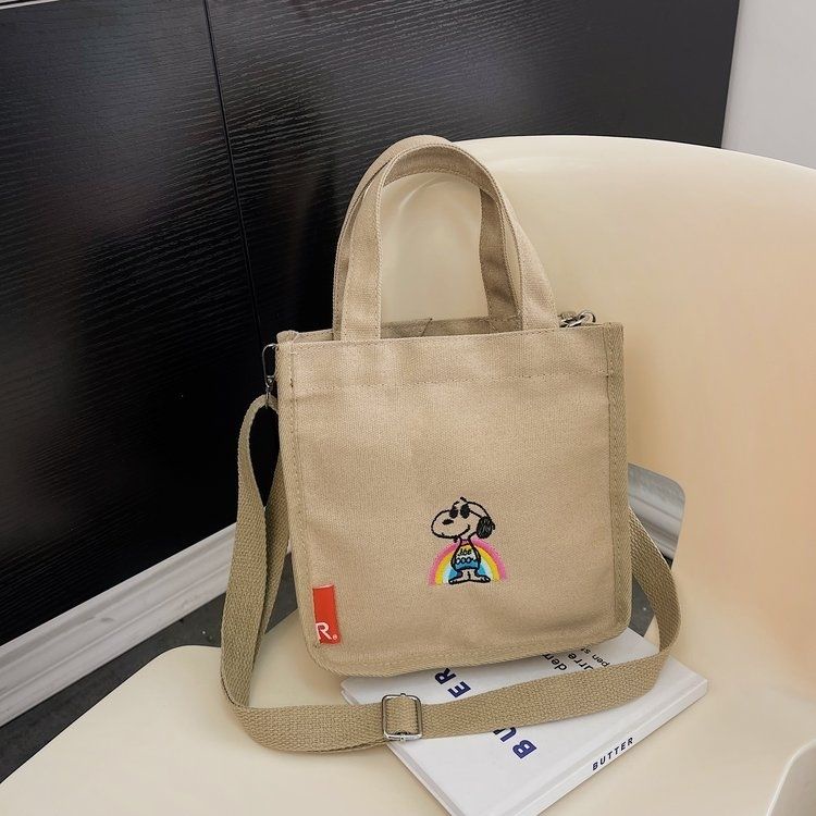กระเป๋าถือ-กระเป๋าสะพายไหล่-ผ้าแคนวาส-ปักลายการ์ตูน-snoopy-แบบพกพา-2023