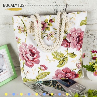 Eutus กระเป๋าถือ กระเป๋าสะพายไหล่ ผ้าแคนวาส พิมพ์ลายกราฟฟิตี้ ดอกไม้ ขนาดใหญ่ ใช้ซ้ําได้ เหมาะกับเดินชายหาด สําหรับผู้หญิง