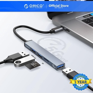 ภาพหน้าปกสินค้าOrico Type C HUB 4 พอร์ต USB 3.0 2.0 Ultra Slim อะแดปเตอร์แยกการ์ดรีดเดอร์ ขนาดพกพา สําหรับคอมพิวเตอร์ (AH-13) ที่เกี่ยวข้อง