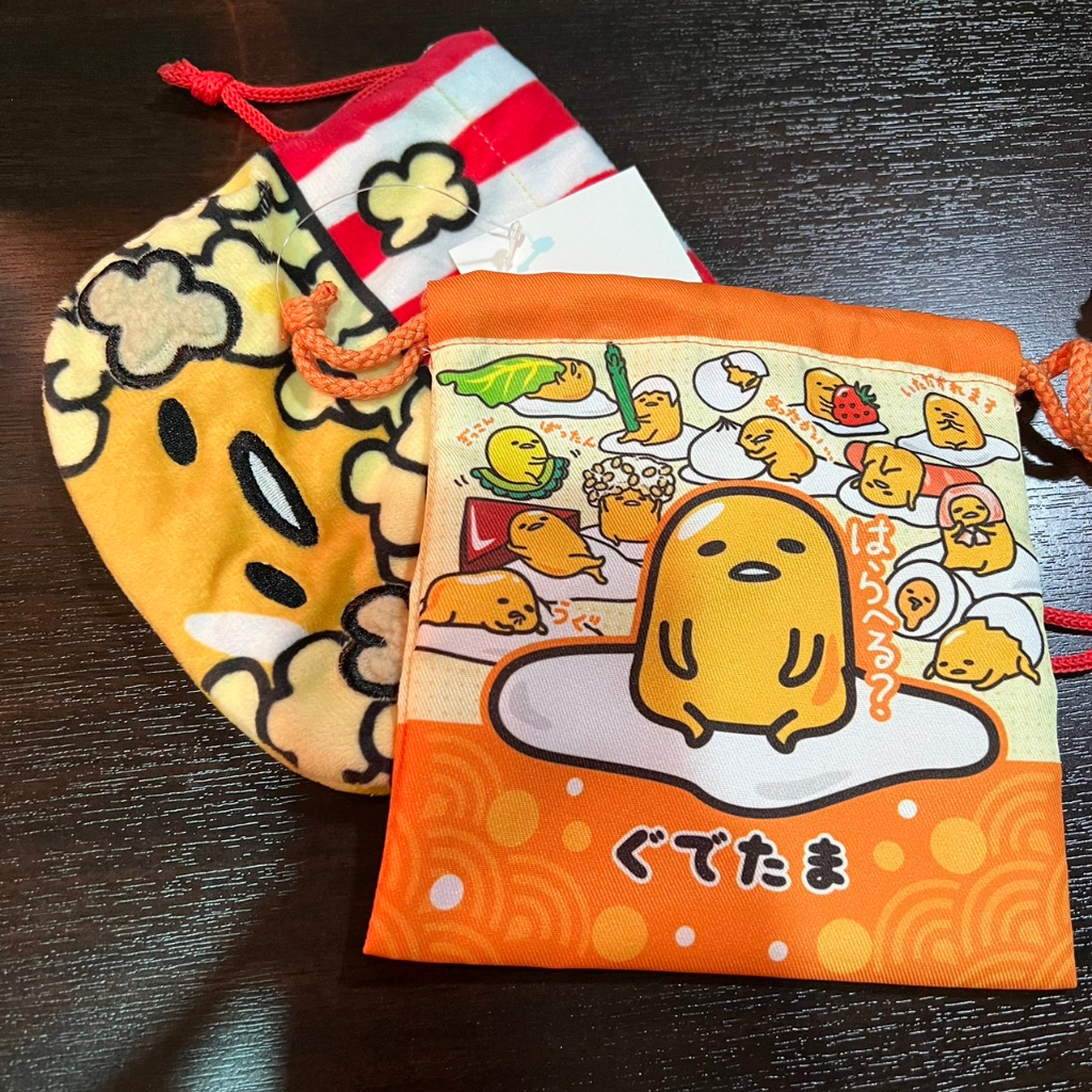 สวยไม่ซ้ำใคร-กระเป๋าผ้ารูด-ไข่ขี้เกียจ-gudetama-usj-จากญี่ปุ่น-sale-for-japan-only-เนื้อผ้านุ่ม-sanrio