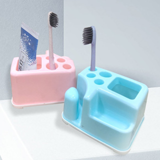กล่องเก็บแปรงสีฟันที่ใส่แปรงในห้องน้ำ