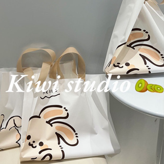 KiwiStudio (แพค50ใบ) ถุงของขวัญพลาสติก ขาวน้ำนม ลายการ์ตูนกระต่าย กระเป๋าช้อปปิ้งมือ 39*39*9cm（091）