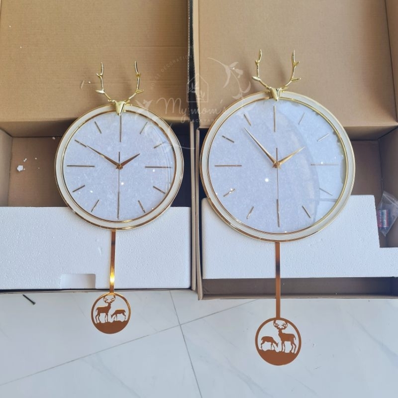 ภาพหน้าปกสินค้าพร้อมส่ง นาฬิกาแขวนผนัง นาฬิกาสีทอง งานจริงสวยมาก นาฬิกาแขวนผนังสุดหรู แบบลูกตุ้ม