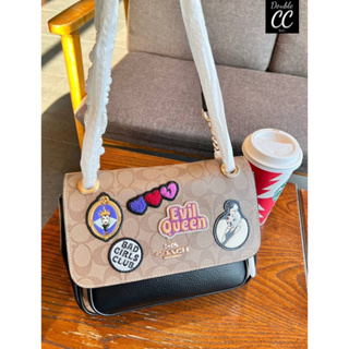 (แท้ 💯%‼ from Factory) NEW ARRIVAL! 🆕🆕🆕  Disney X Klare Crossbody 25 In Signature Canvas With Patches((CC152))