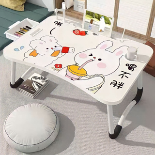 ภาพขนาดย่อของภาพหน้าปกสินค้าโต๊ะญี่ปุ่น โต๊ะพับได้ โต๊ะเขียนหนังสือ โต๊ะนั่งพื้น ลายน่ารัก พับได้เก็บได้น้ำหนักเบา ใช้สำหรับวางโน๊ตบุ๊ค หรือเขียนหนั จากร้าน kaikashopp บน Shopee