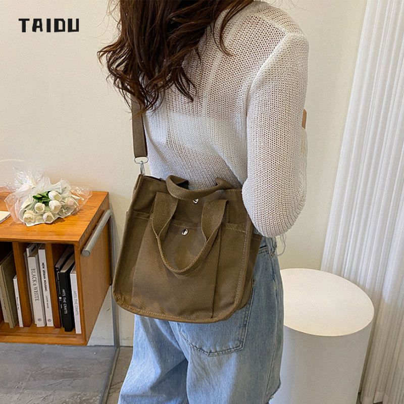 taidu-กระเป๋าแมสเซนเจอร์แบบเรียบง่ายของญี่ปุ่น-กระเป๋าผ้าใบธรรมดา-นักเรียน-แมตช์แบบสบาย-ๆ